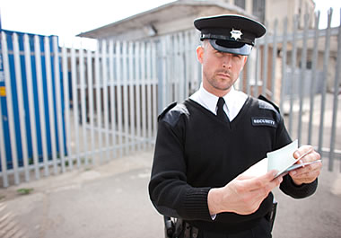 A border guard inspecting documents