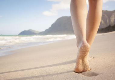 Walking barefoot along the beach