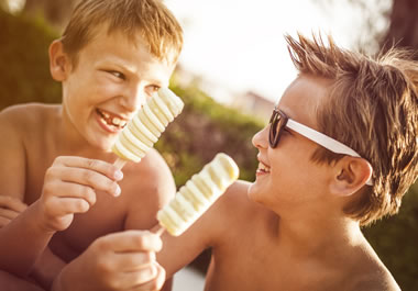 Boys eating ice cream during the dog days of summer