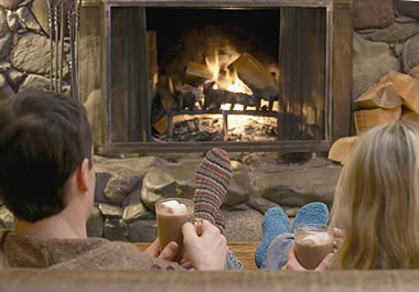 The couple is hunkering down by the fire.