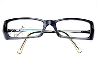 A pair of glasses with a broken lens