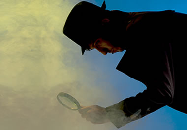 A private investigator holding a magnifying glass