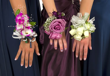 The women are wearing corsages.