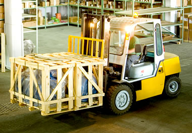 Moving a large crate with a forklift