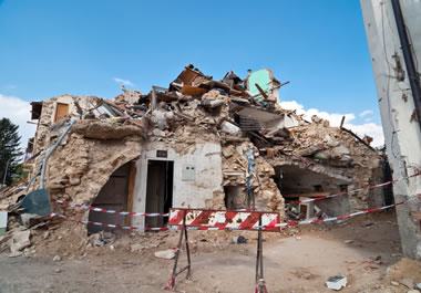 An earthquake reduced parts of the town to rubble.