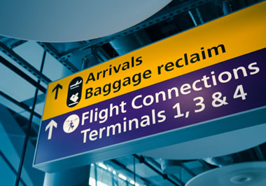 Sign pointing to airport terminals