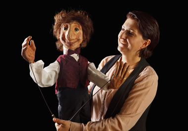 A ventriloquist with her dummy