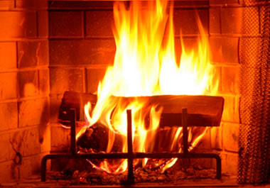 A fire blazing in a fireplace