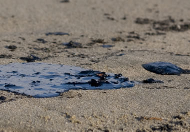 Residue on the beach from an oil spill