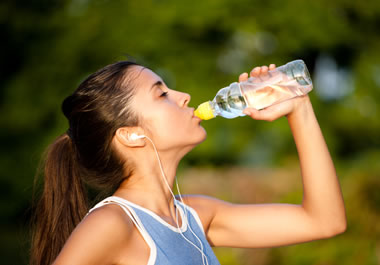 A jogger stopping to hydrate