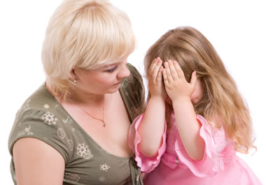A mother chiding her daughter for bad behavior