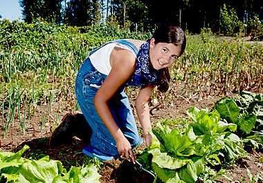 Teenager working in an organic garden