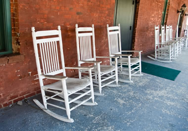Wooden rocking chairs on a porch