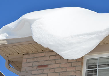 Snow accumulating on a roof