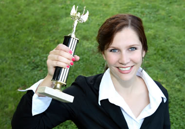 Winner holding up her trophy