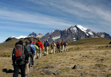 The hikers are trekking in the mountains.
