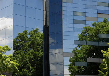The glass faÃ§ade of this building reflects its environment.