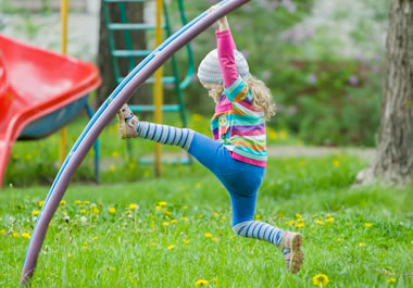 The girl is a dynamo on the playground.