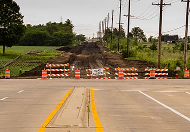 The city barricaded the unfinished part of the road.