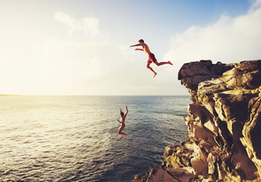 The swimmers made a daring leap off the cliff.