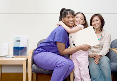 The girl is expressing her gratitude for the nurse's help.