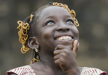 Happiness is emanating from the girl.