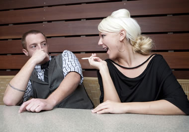 The man finds the woman's smoking repulsive.