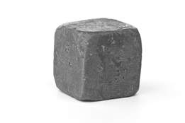 a cube of pure lead metal against a white background 
