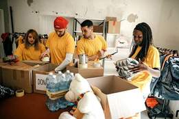 a group of volunteers arranging donations