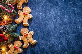 gingerbread cookies and pinecones on table