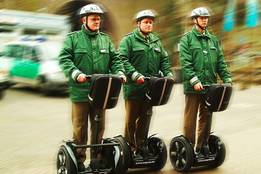 three police officers on segway personal transporters