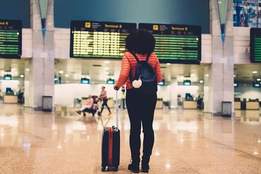 woman looking at departures board
