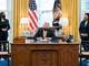 joe biden signing legislation in oval office