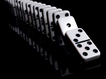 line of dominos falling down