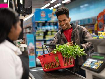 man buying fewer than 10 items at supermarket