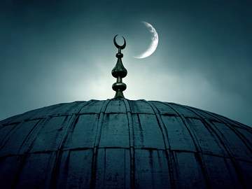 mosque with crescent moon in background