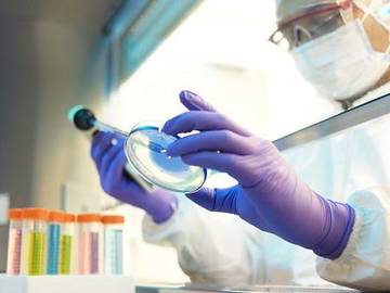 scientist-with-petri-dish