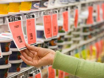 shopper inspecting sale prices