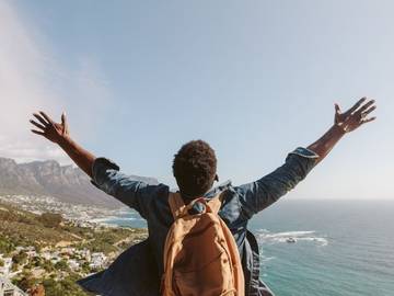 uninhibited man on mountain photo