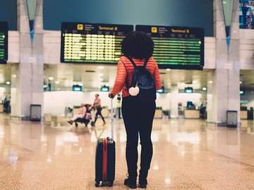 woman looking at departures board