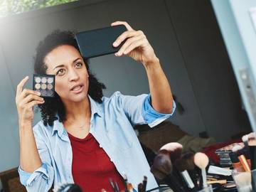 woman taking selfie talking to camera