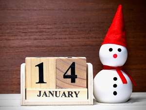 14 january on wood blocks next to snowman figure