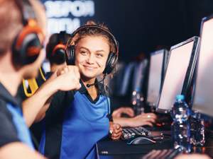 young video game players exchanging fist bumps at a tournament