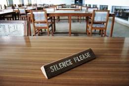 empty library with silence please placard