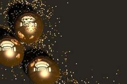 gold balloons and glitter on dark background
