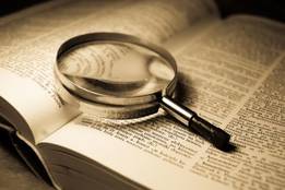 open-dictionary-with-magnifying-glass