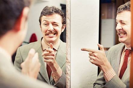 man-winking-in-mirror