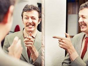 man-winking-in-mirror