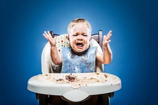 angry-baby-covered-in-food