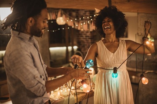 couple setting up for dinner party photo